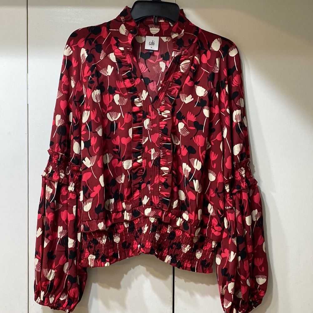 The Corsage Blouse poly crepe fabrication billowing bishop sleeves and ruffle